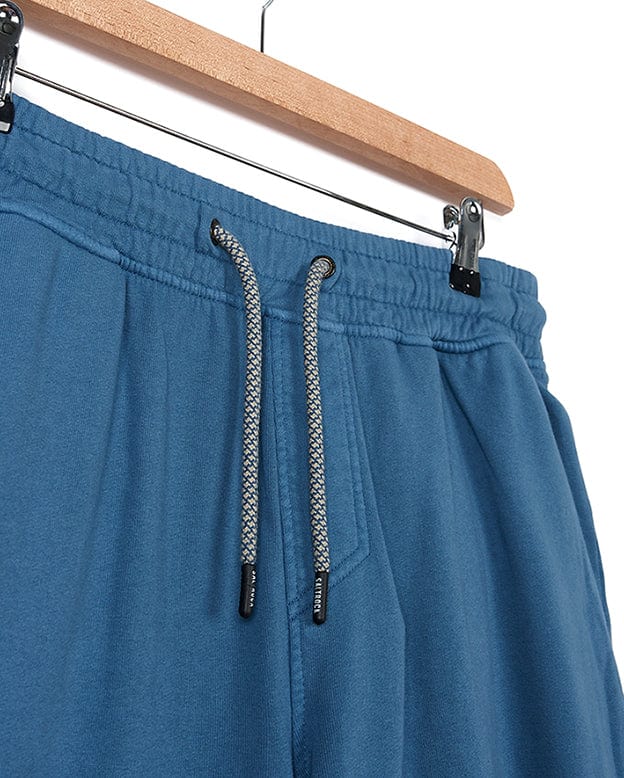 A stylish pair of Ralfen - Mens Slimfit Sweatpants - Blue by Saltrock hanging on a hanger.