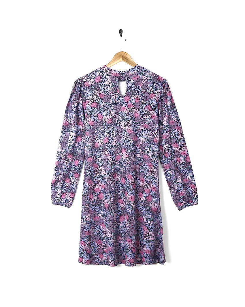 A Saltrock Ramona Womens Mock Jersey Dress - Purple with a ditsy print hanging on a hanger.