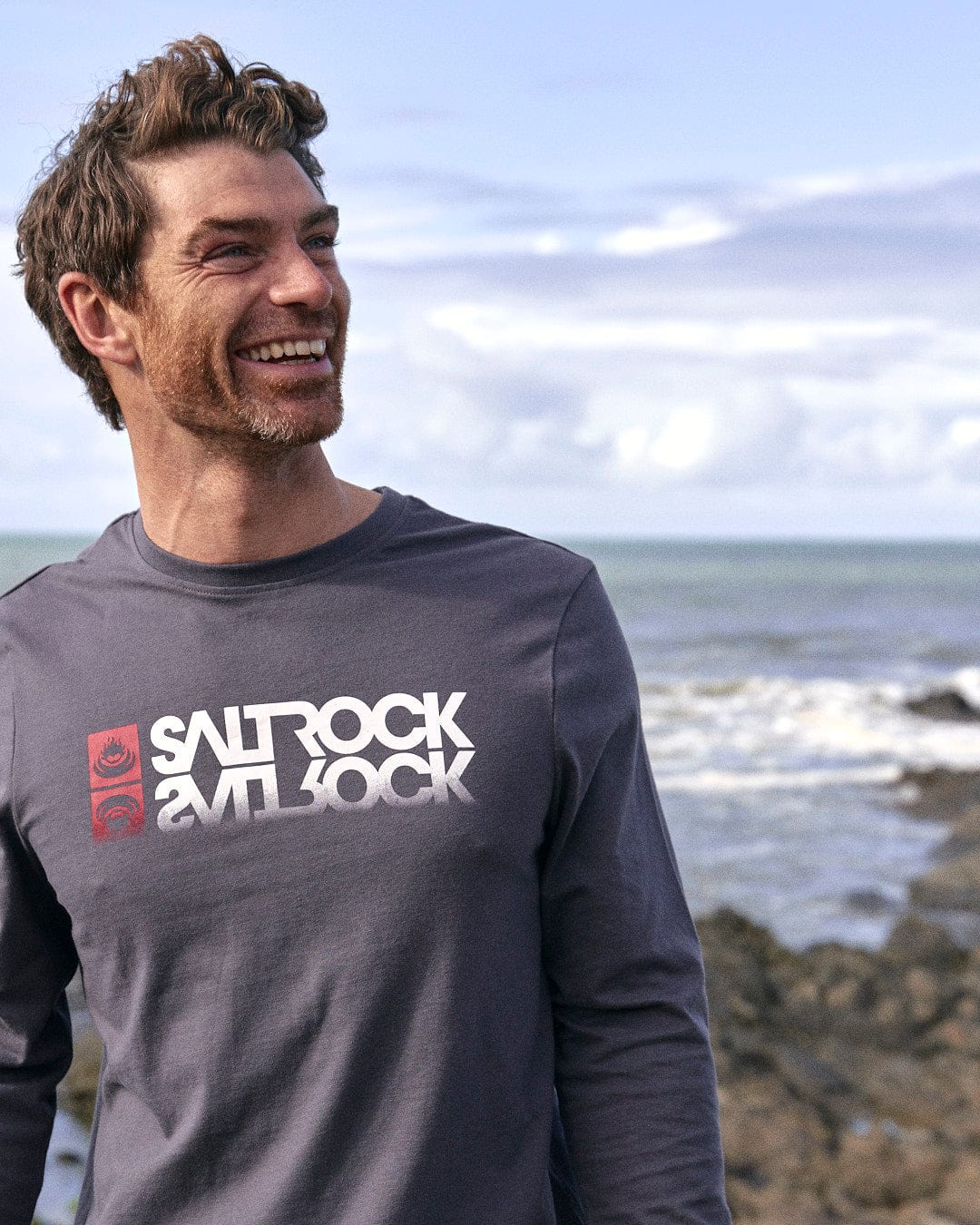 A man wearing a Saltrock Reflect - Mens Long Sleeve T-Shirt - Grey with Saltrock branding.