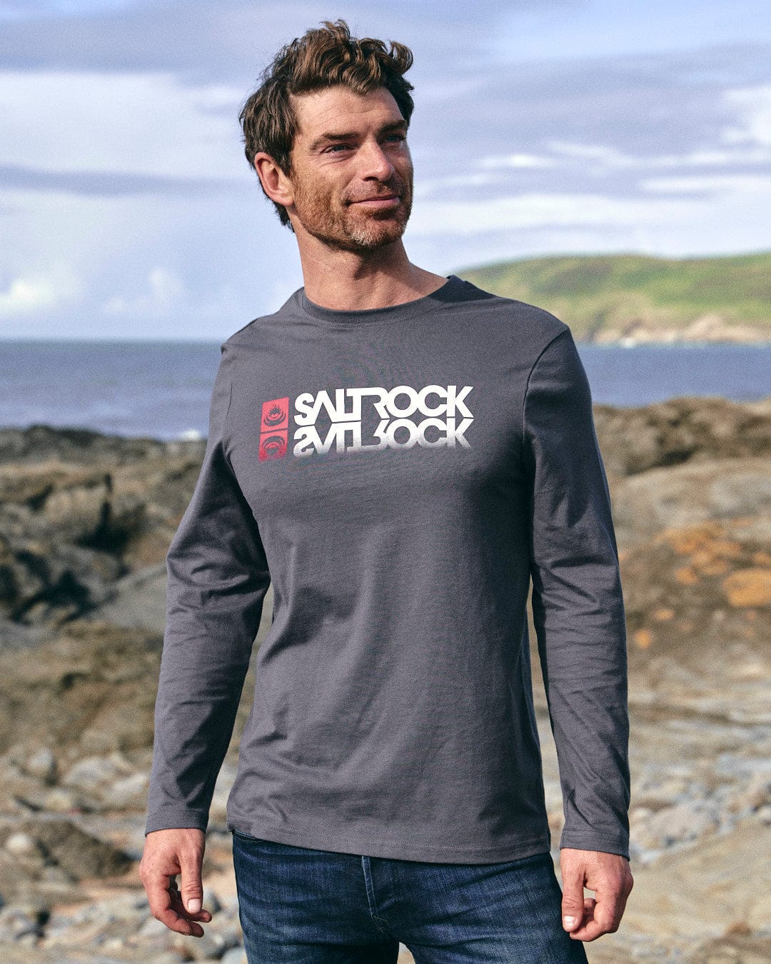 A man wearing a Reflect - Mens Long Sleeve T-Shirt - Grey with Saltrock branding.