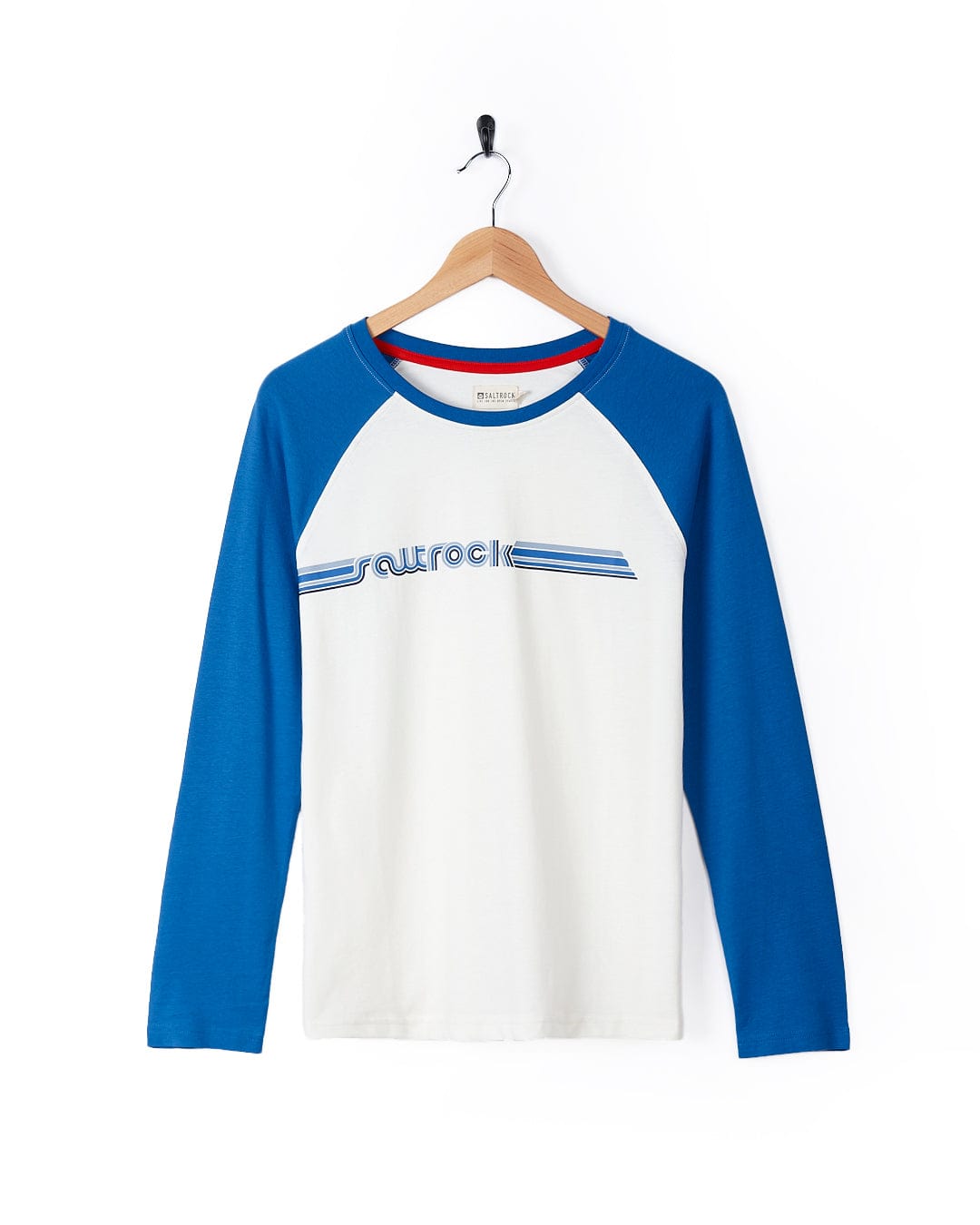 A Retro Ribbon - Womens Raglan Long Sleeve T-Shirt - White made of cotton, featuring the word "surf" on it.