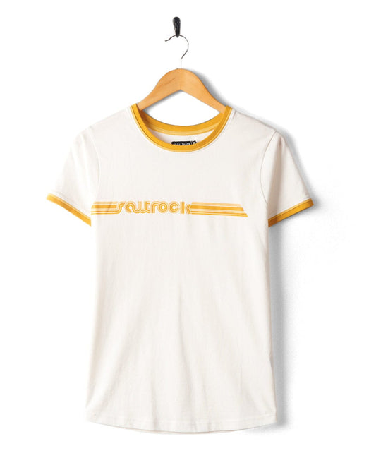 Retro Ribbon - Womens Shorts Sleeve T-Shirt - White with retro stripes in yellow accent bands on the sleeves and collar, featuring a horizontal yellow stripe pattern and Saltrock branding printed in the center. Made from 100% cotton, it is hanging on a wooden hanger.
