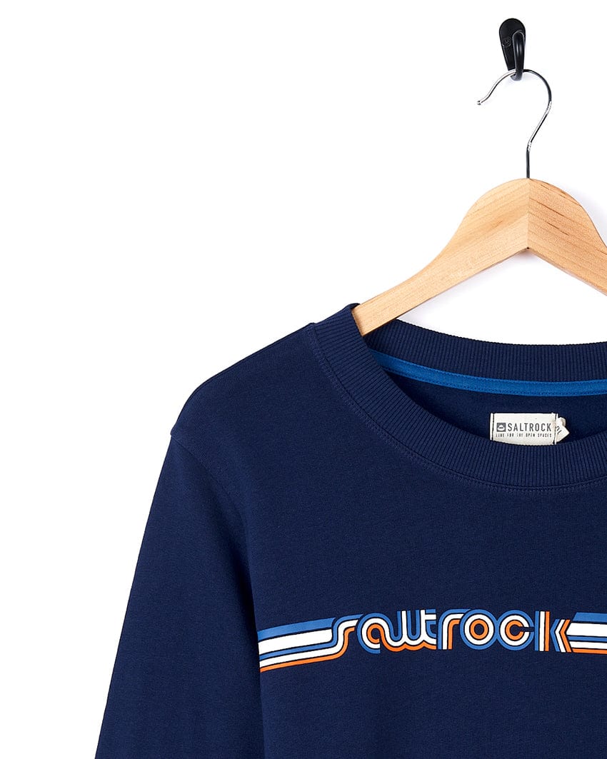 A Retro Ribbon - Womens Sweat - Blue with the brand name Saltrock on it.