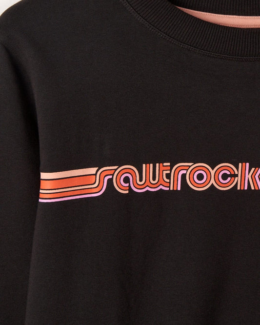 Close-up of a dark grey Retro Ribbon Tape womens sweatshirt by Saltrock with a pink and orange "squerock" graphic design on the chest.