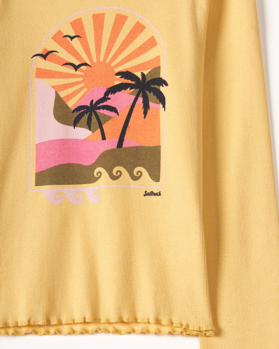 A stretchy jersey Retro Seascape - Kids Long Sleeve T-Shirt in yellow with a sunset print featuring palm trees by Saltrock.
