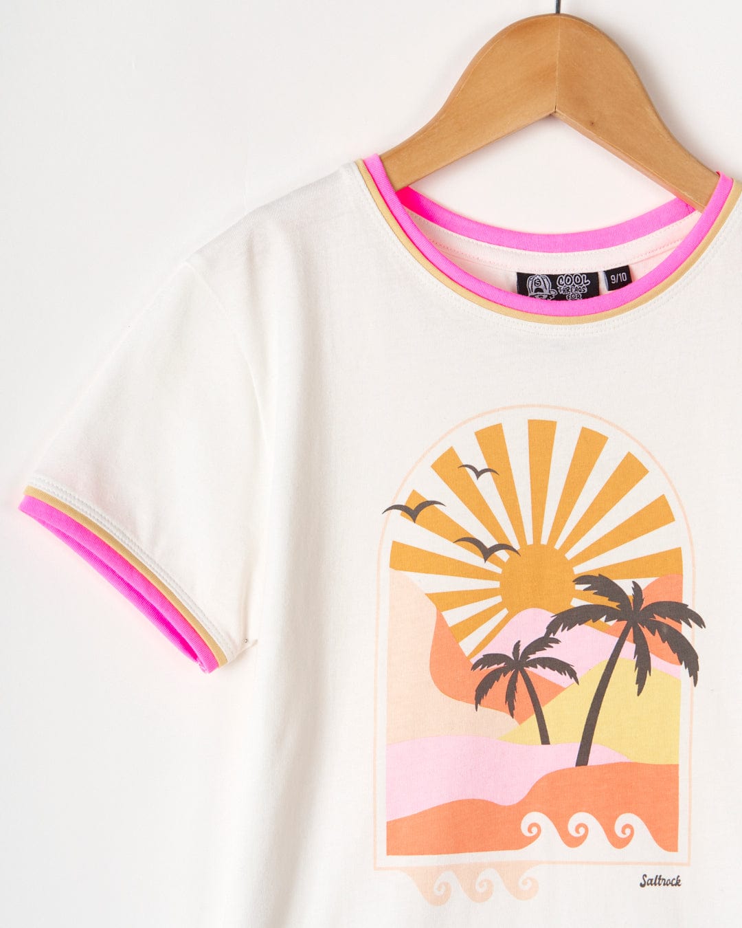 A Retro Seascape - Kids Short Sleeve T-Shirt - White with a sunset illustration of palm trees on the beach, made of 100% cotton by Saltrock.