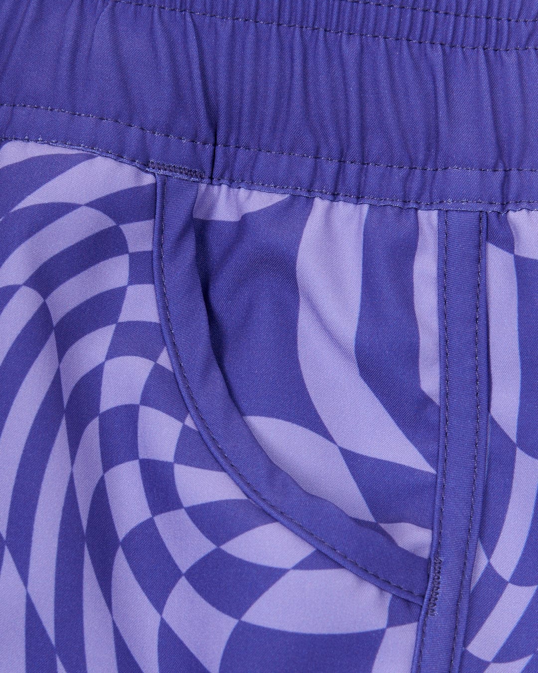 A purple and white Saltrock Rezz - Kids Boardshorts with a swirl pattern.