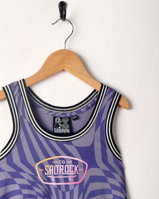Saltrock Purple striped Rezz - Kids Recycled Warp Vest Dress with geometric print, hanging on a wooden hanger against a white background.