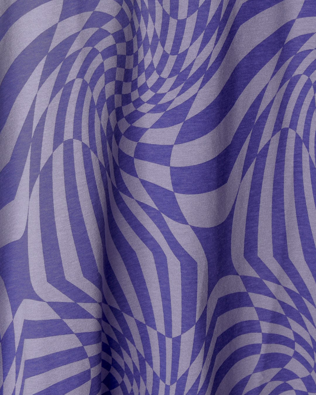 Close-up view of a Saltrock Rezz - Kids Recycled Warp Vest Dress - Purple with a blue and white geometric print optical illusion pattern made from recycled materials.