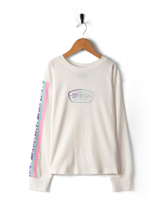 A white Rezz Sleeve Kids Recycled Long-Sleeved T-Shirt by Saltrock with a logo reading "saintrock" hanging on a black hanger against a white background. A pink and purple stripe runs down one sleeve.