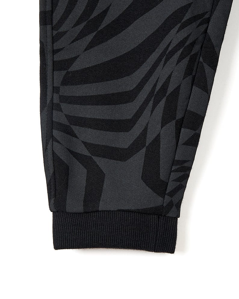 A comfortable and stylish pair of Rip It - Kids Jogging Bottom - Black joggers with a zebra print by Saltrock.
