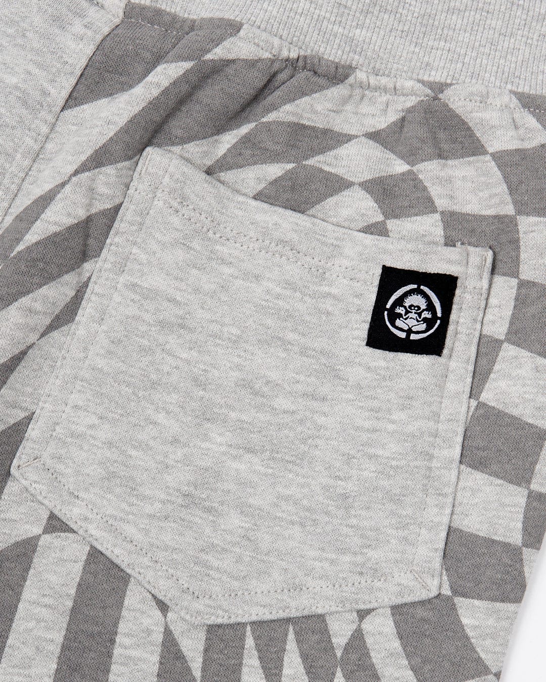 A Rip It - Kids Jogging Bottom - Grey with a Saltrock logo on the pocket.