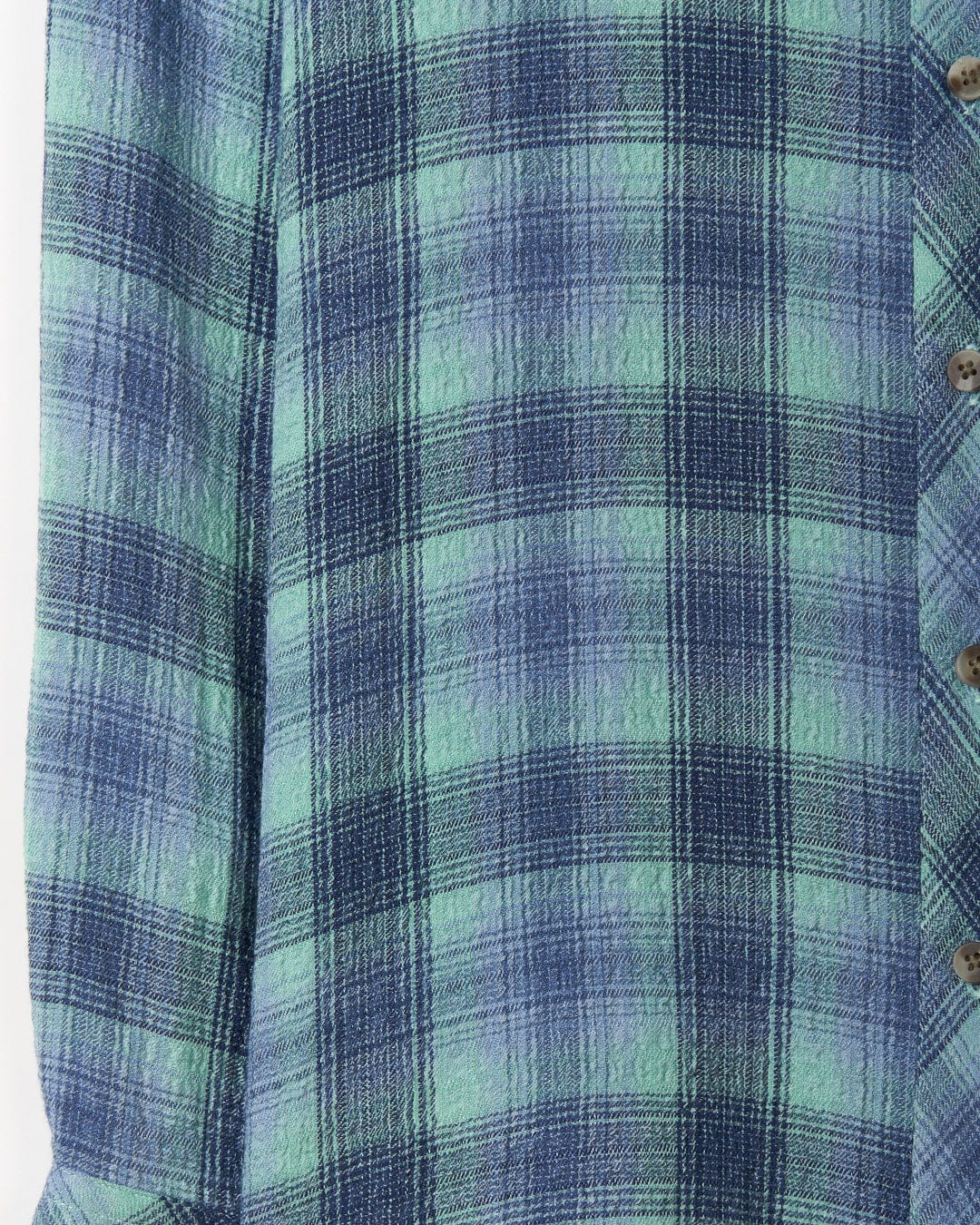 Close-up of a lightweight, Saltrock Rosalin - Womens Longline Shirt in shades of green and blue with button details.