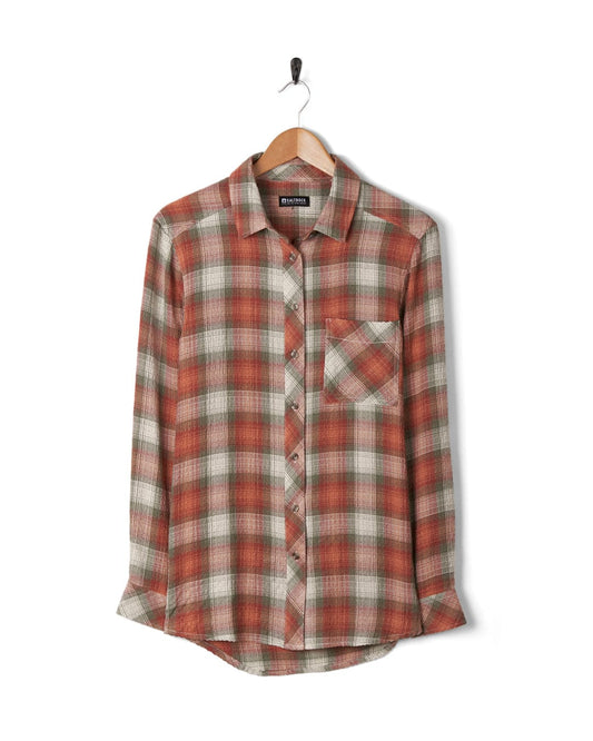 Longline plaid shirt on a hanger against a white background with contrasting buttons. 
Product Name: Rosalin - Womens Long Sleeve Shirt - Orange/green 
Brand Name: Saltrock