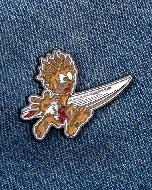 Animated Saltrock Running Man character pin on denim fabric.