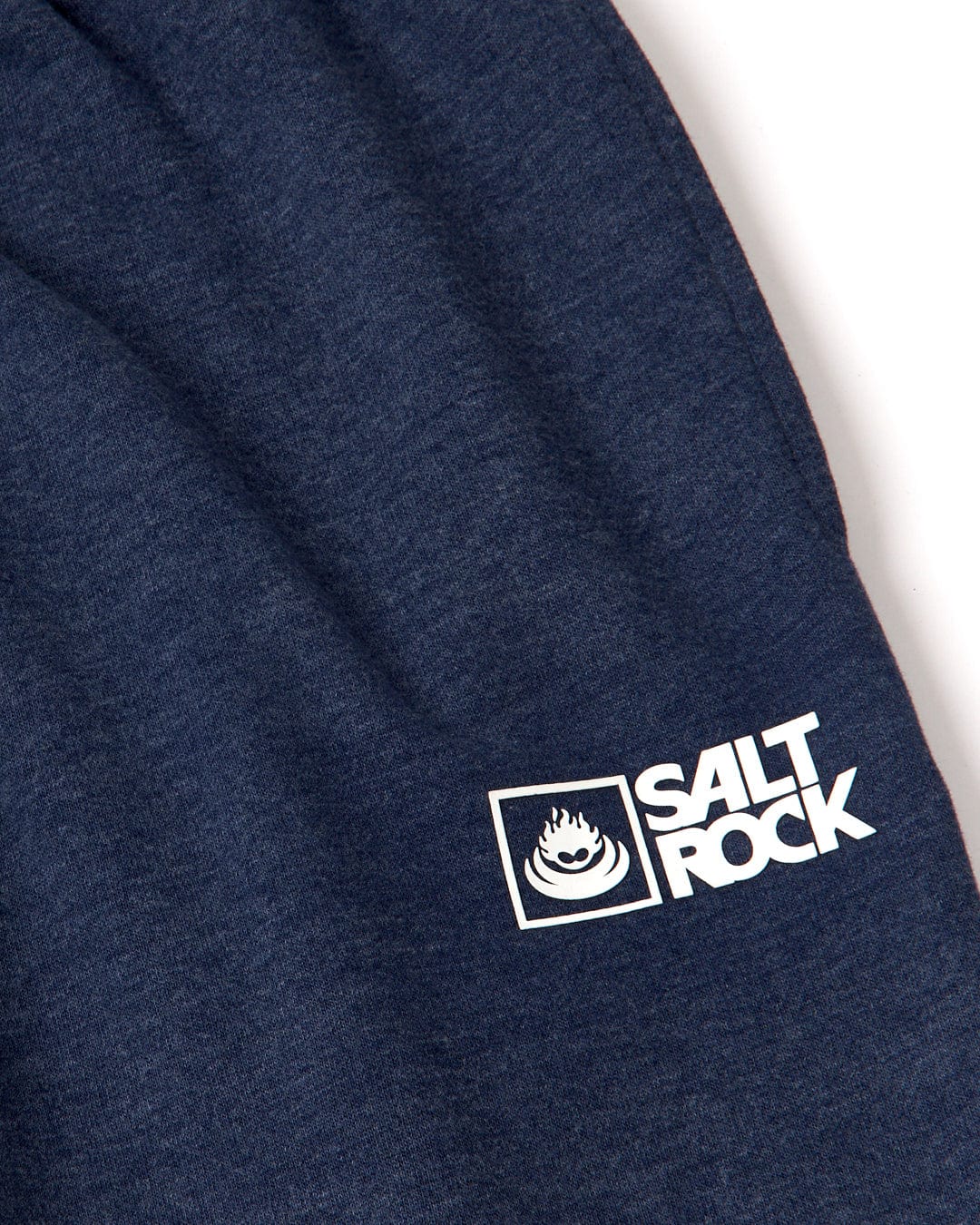 Close-up of a dark blue soft jersey material with the "Saltrock Original - Mens Joggers - Blue Marl" branding.
