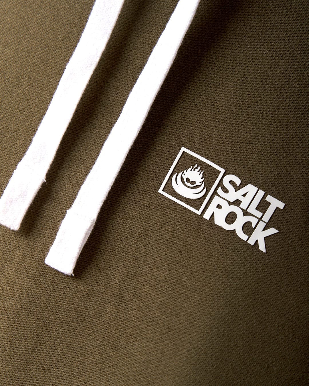Close-up of the Saltrock Original Men's Pop Hoodie in green, featuring a drawcord hood and soft jersey material. The white "Salt Rock" logo with a flame icon stands out, exemplifying classic Saltrock branding.