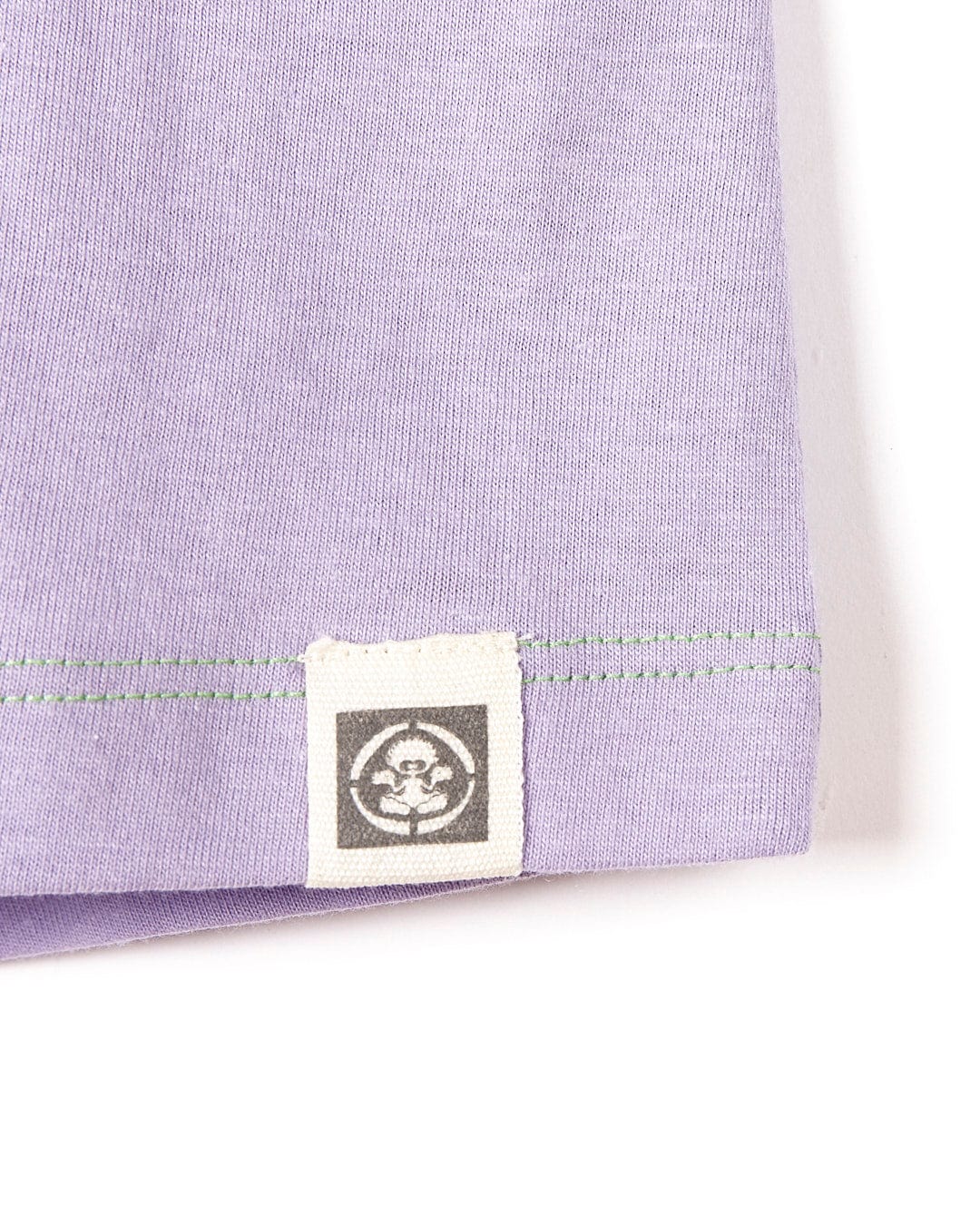 A Saltrock Samarria Tex - Kids Short Sleeve T-Shirt - Light Purple with a logo on it.