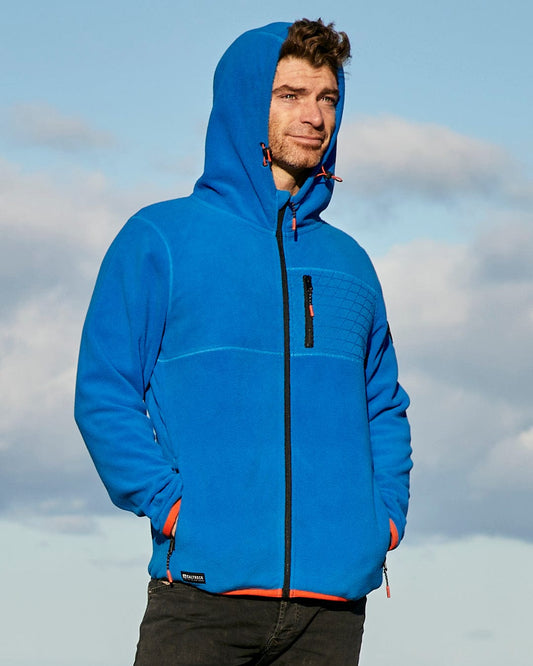 A man wearing a blue hooded jacket featuring Saltrock branding.
.
A man wearing a blue hooded jacket featuring Senja - Mens Fleece Hoodie - Blue by Saltrock.