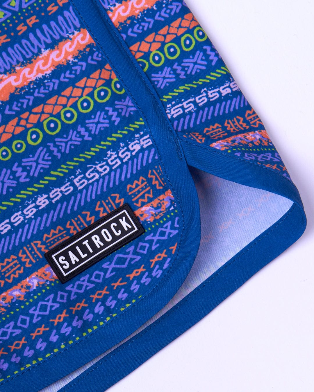 A Silas boardshorts made from Repreve recycled material with a colorful pattern by Saltrock.