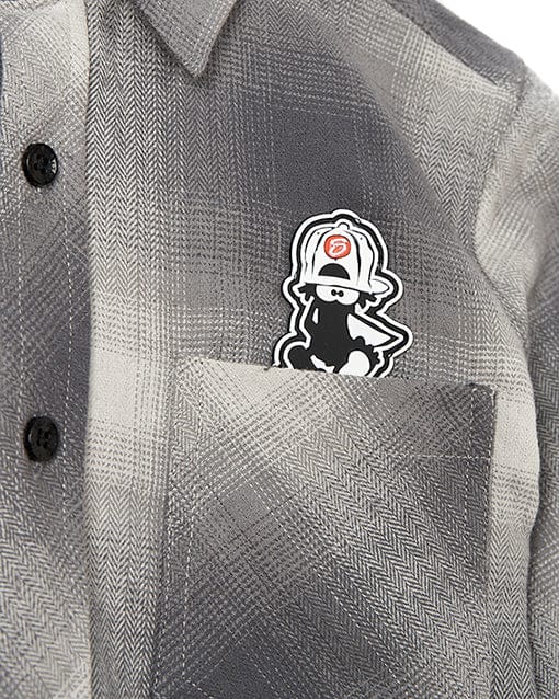 A Slacker - Kids Shirt - Grey by Saltrock with a patch of a cartoon character on it.