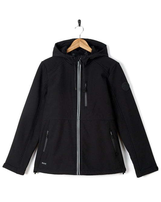 A Saltrock Solae 2 - Womens Softshell Jacket - Black hanging on a hanger.