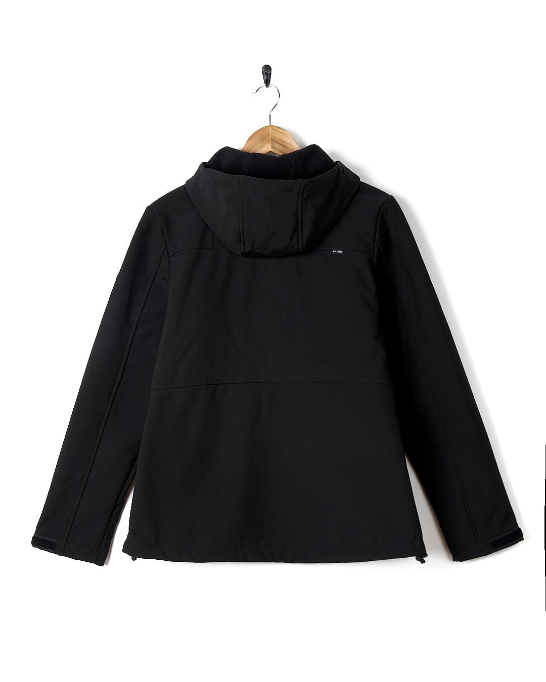 A Solae 2 - Womens Softshell Jacket - Black by Saltrock hanging on a hanger.