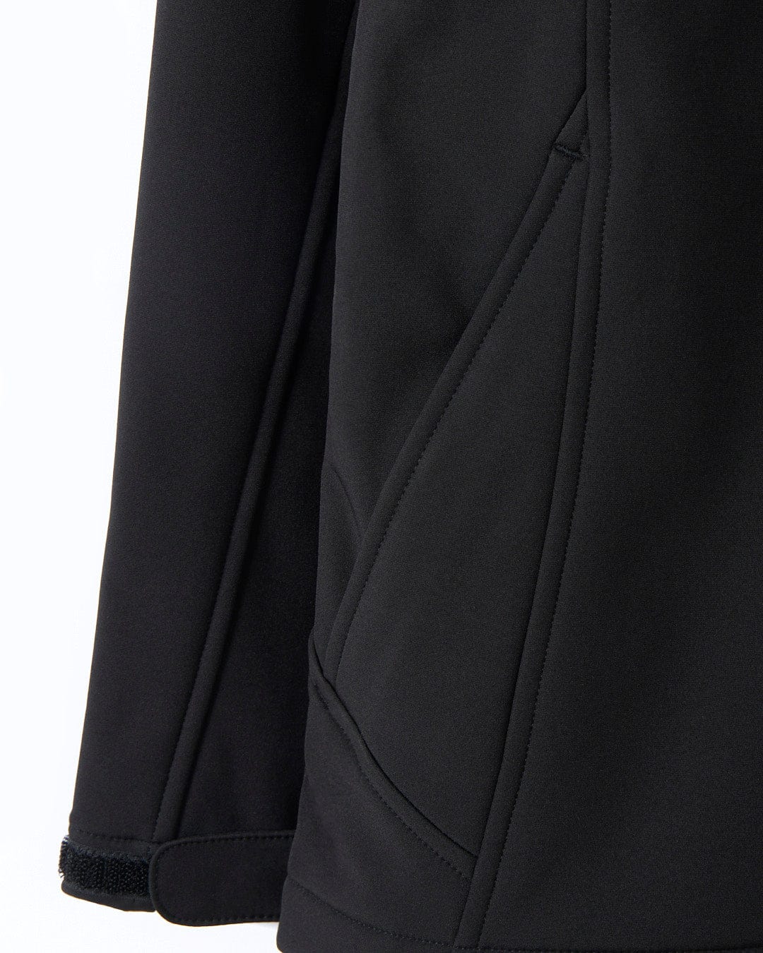 The back of a Solar - Womens Softshell Jacket - Black - SS24 with a zippered pocket, Saltrock.
