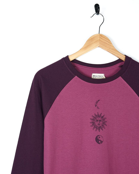 A Solstice - Womens Long Sleeve Raglan - Dark Pink sweatshirt by Saltrock with a moon and sun on it.