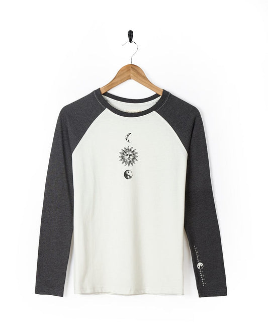 A white and black Solstice - Womens Long Sleeve Raglan - Cream shirt with a sun and moon on it by Saltrock.