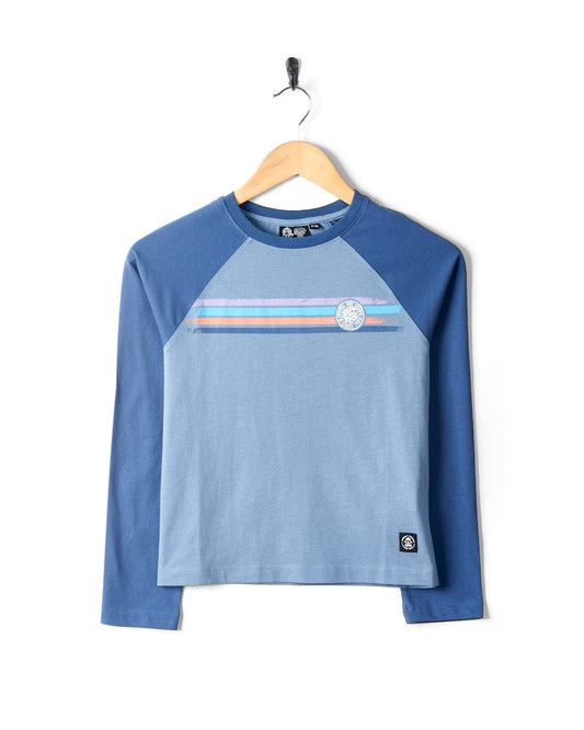 Blue Spray Stripe - Kids Raglan Long Sleeve T-Shirt from Saltrock, hanging on a black hanger against a white background.