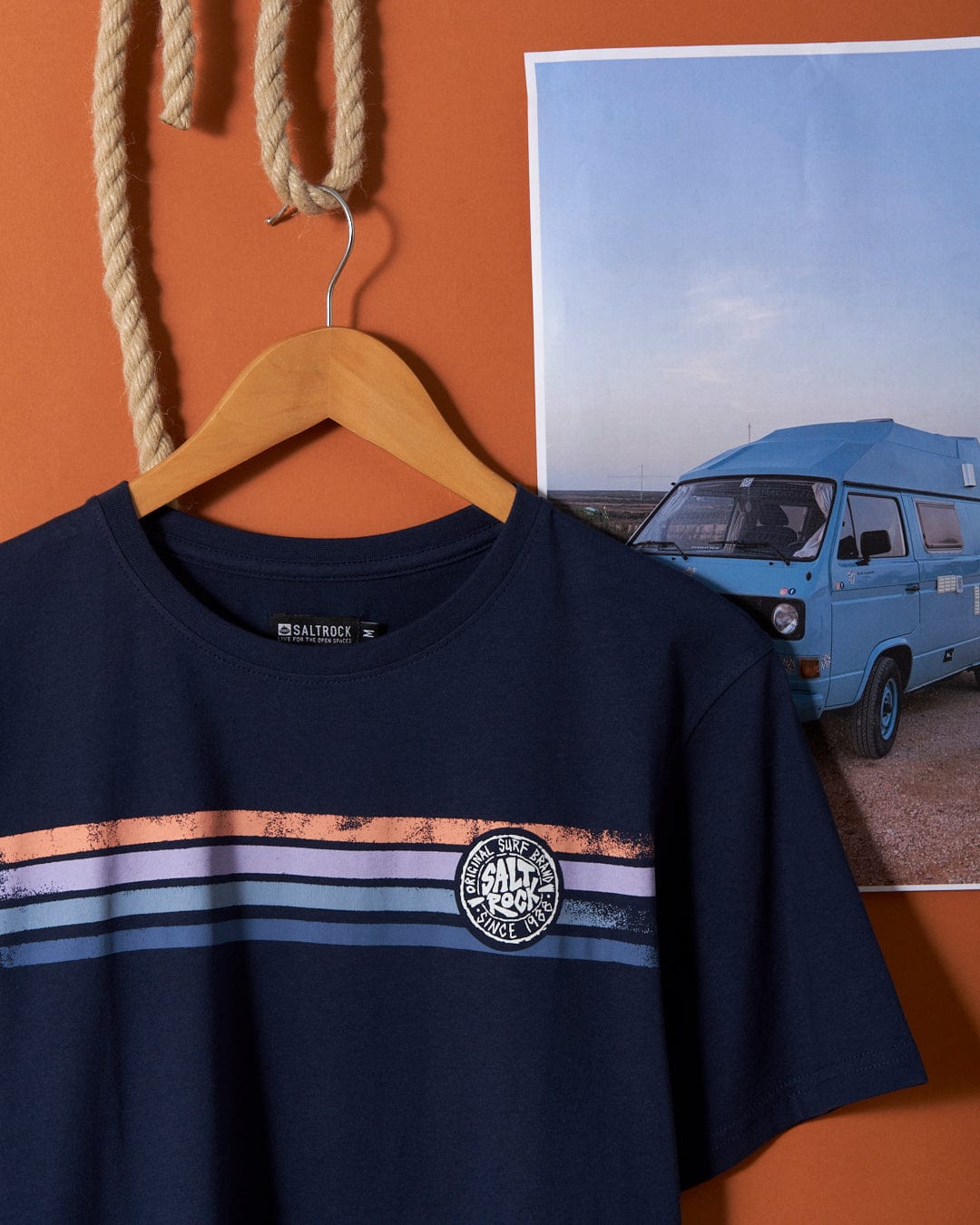 A Spray Stripe - Mens Short Sleeve T-Shirt - Blue with a picture of a van and Saltrock branding on it.