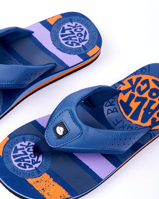 A pair of Saltrock SR Original Mens Flip Flops in Blue with graphic prints on the insoles, featuring a blue toe strap, displayed on a white background.