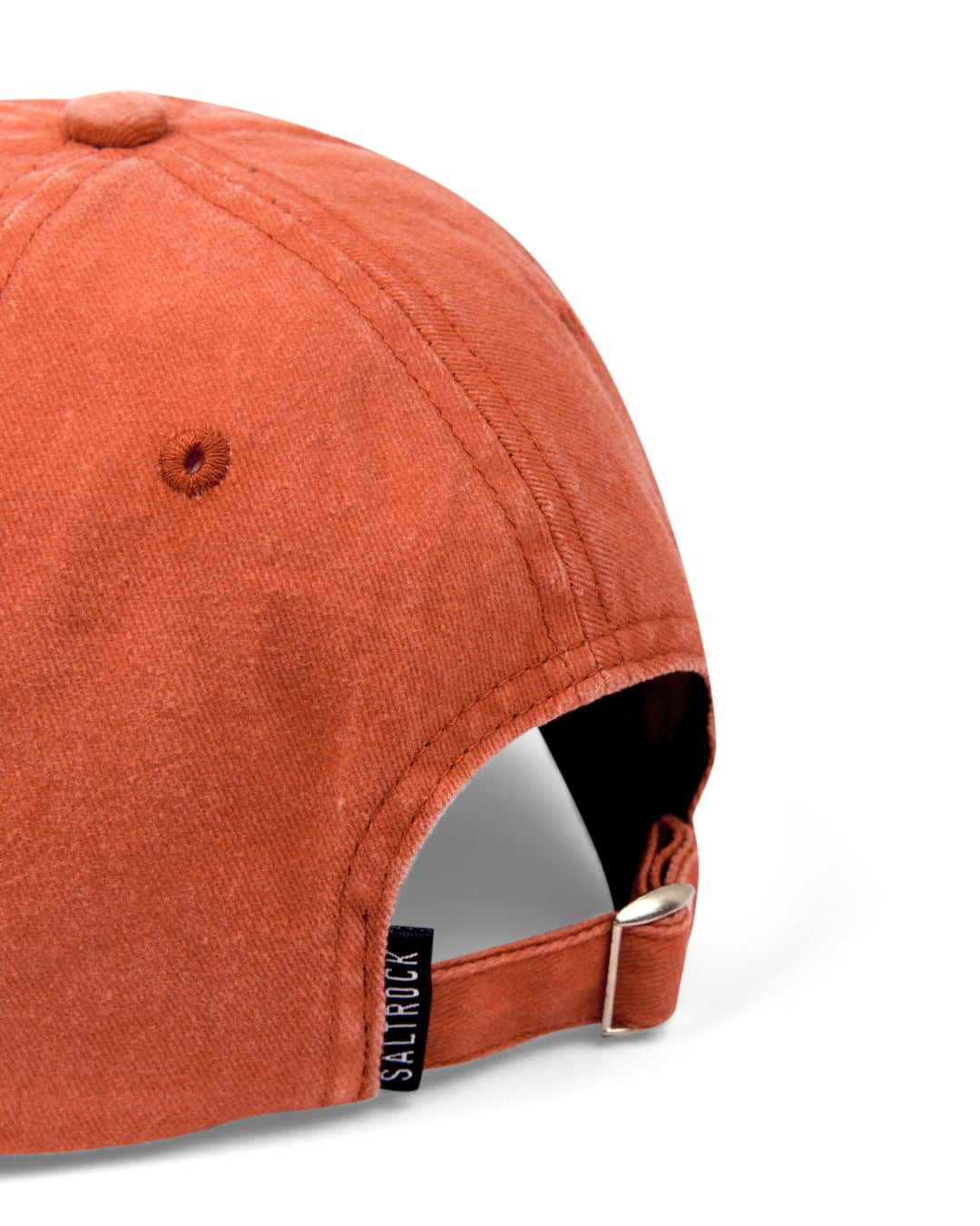 Close-up of a Burnt Orange SR Original Cap with an adjustable strap and a Saltrock branded badge visible.