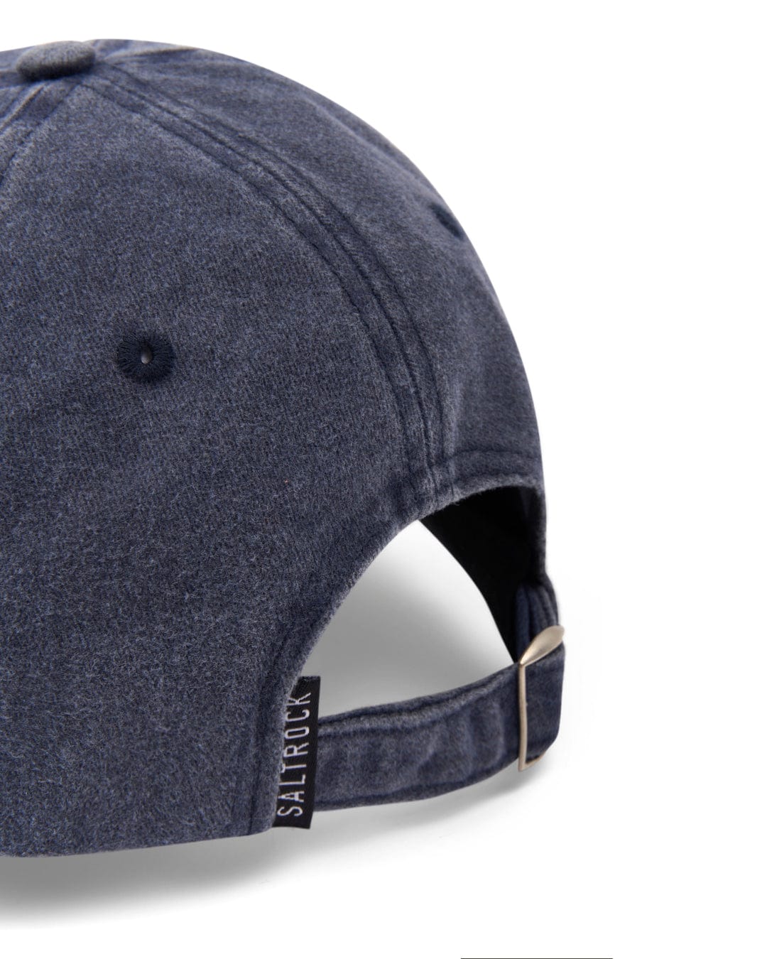Close-up of a dark blue SR Original Cap with an adjustable strap, displaying the "Saltrock" brand label.