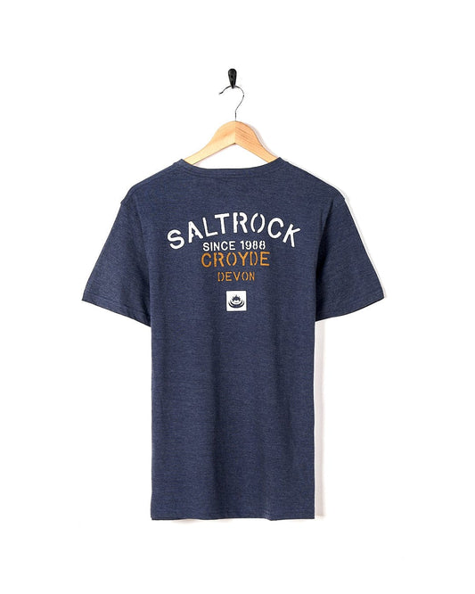 A Stencil - Mens Location T-Shirt - Croyde - Dress Blue with the brand name Saltrock on it.