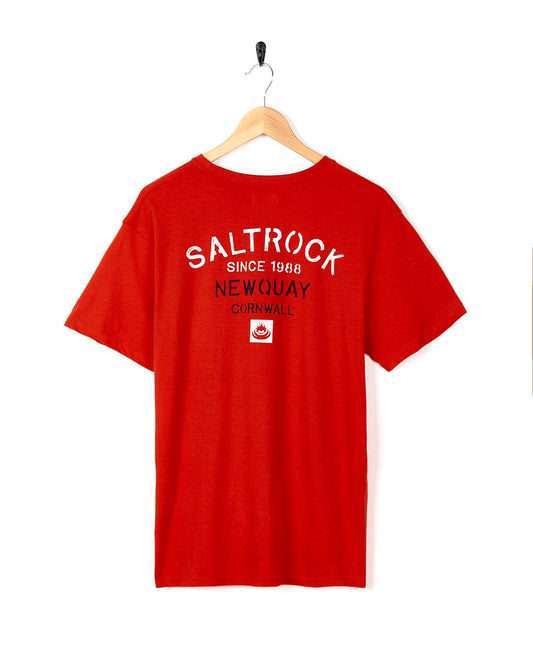 A Stencil - Mens Newquay Location T-Shirt - Red with the brand name Saltrock on it.