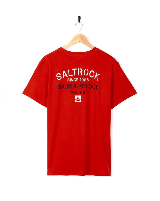 A Stencil - Mens Saundersfoot Location T-Shirt - Red with the brand name Saltrock on it.