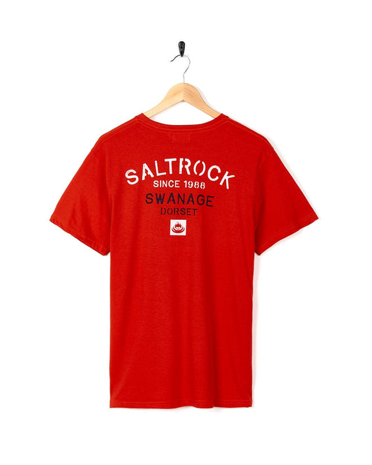 A Stencil - Mens Location T-Shirt - Swanage - Red with the brand name Saltrock on it.