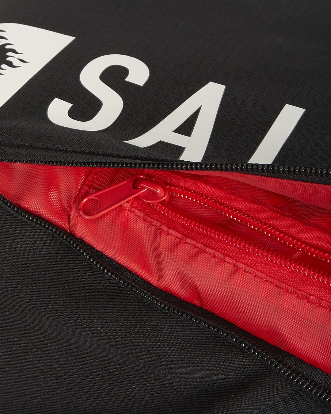 A Saltrock Streamline - Backpack - Black with the word sailor on it.