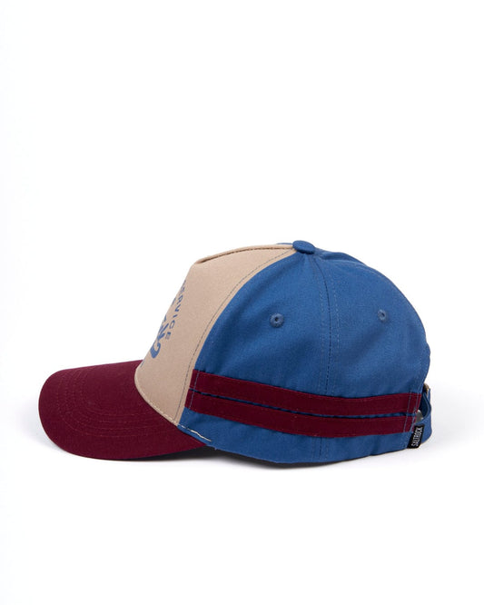 A Strike baseball cap with a blue from Saltrock stripe, featuring an adjustable strap.