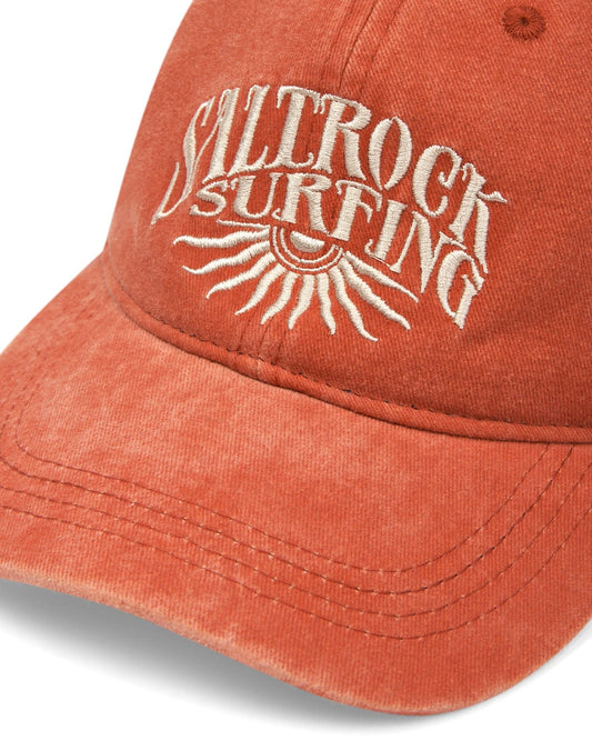 Burnt Orange Sunburst Cap with Saltrock Surfing embroidery and graphic.