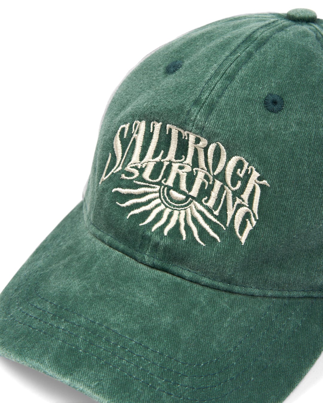 A green Sunburst Cap with the Saltrock branding embroidered logo on the front and a curved visor.