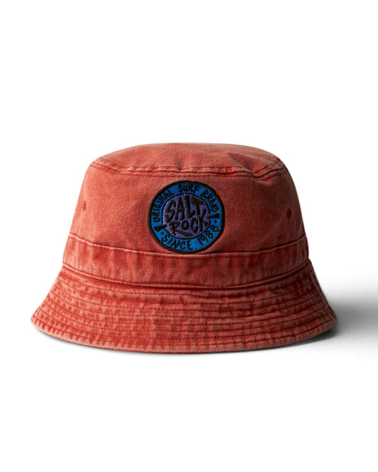 Burnt Orange cotton bucket hat with a Saltrock badge on a white background.