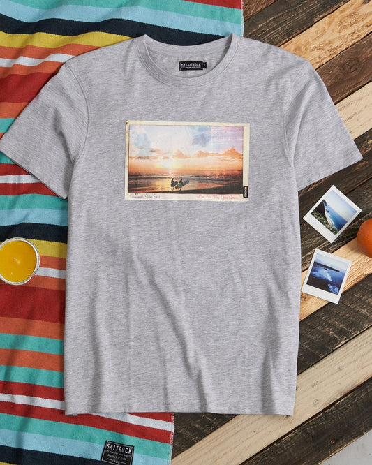 A Saltrock crew neck Sun Sets t-shirt with a digital print of a sunset on the beach.