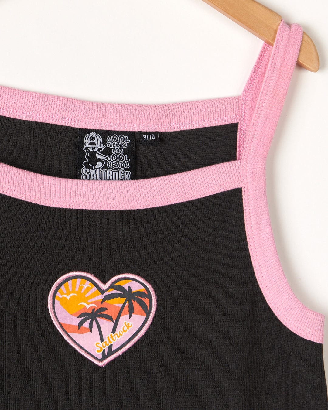 A ribbed Sunshine State - Kids Dress - Black with a pink heart embroided on it.