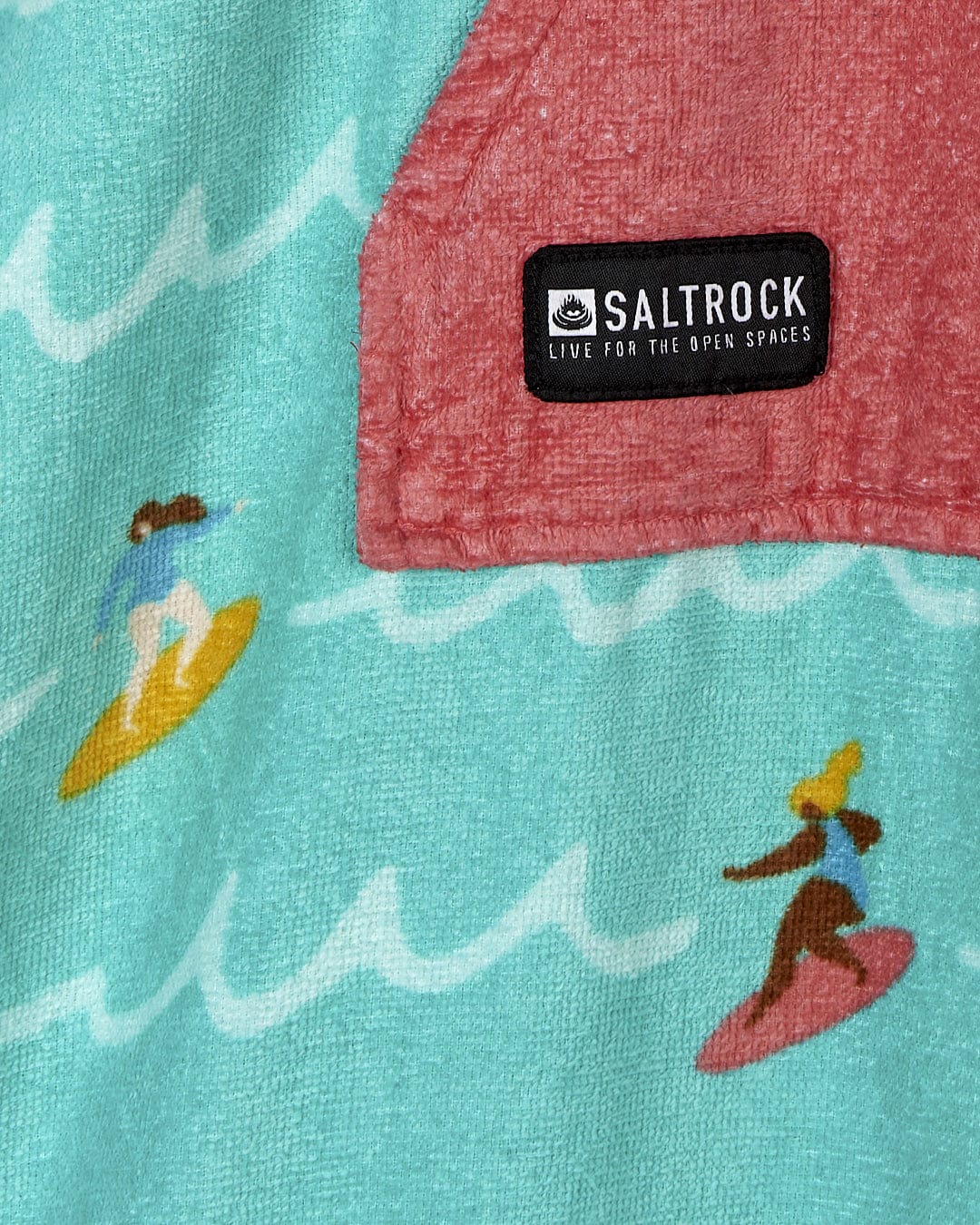 A Surf Sister - Kids Changing Towel - Turquoise shirt with surfboards and surfers on it. Brand: Saltrock