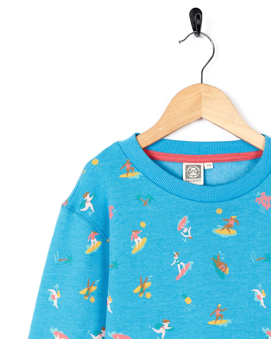 A Surf Sisters Kids Recycled Long Sleeve Sweatshirt with a print of surfers and surfboards by Saltrock.