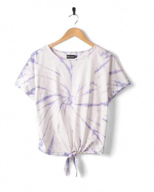 White and purple Swirl tie-dye t-shirt with a knot on the front, made of peached soft material, hanging on a wooden hanger against a white background by Saltrock.