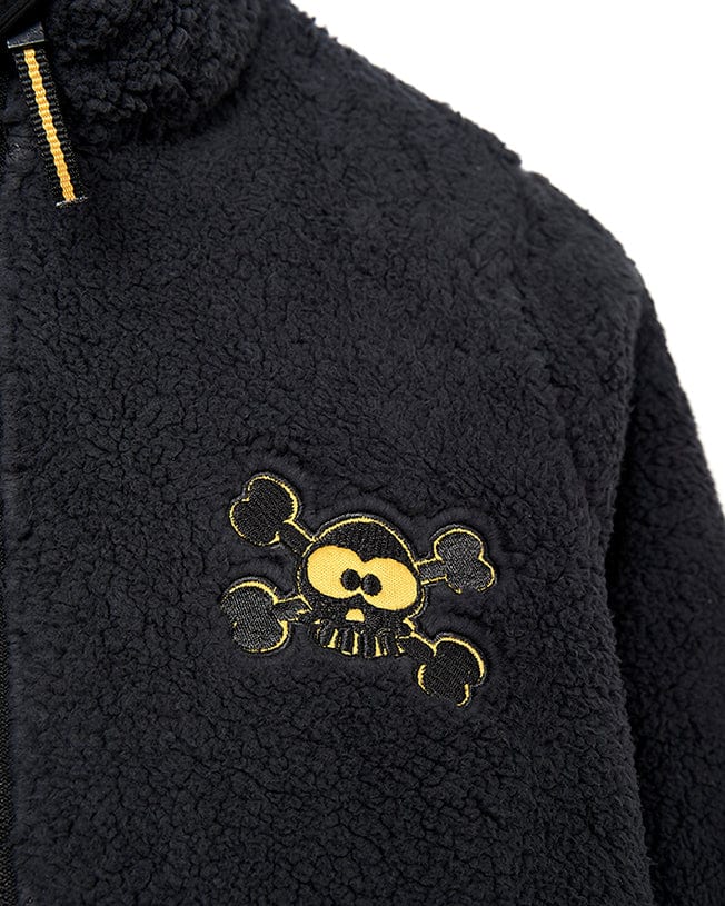 A cozy Saltrock Tagged - Kids Sherpa Fleece - Black jacket with a skull and crossbones embroidered on the front.